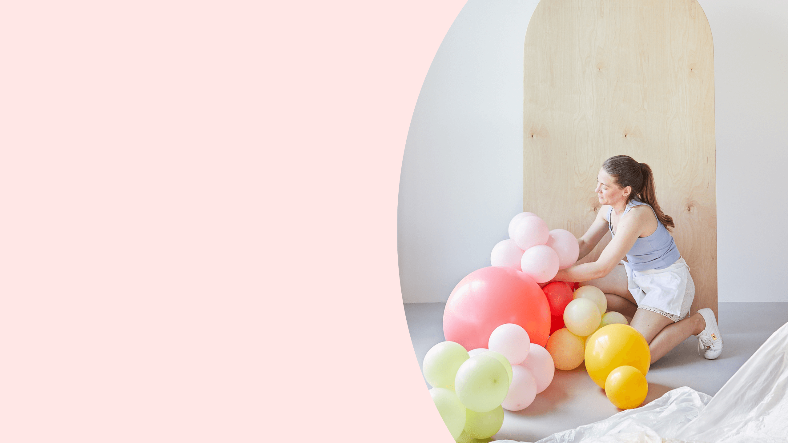 Float Balloons Hero Image pink background lady with balloons
